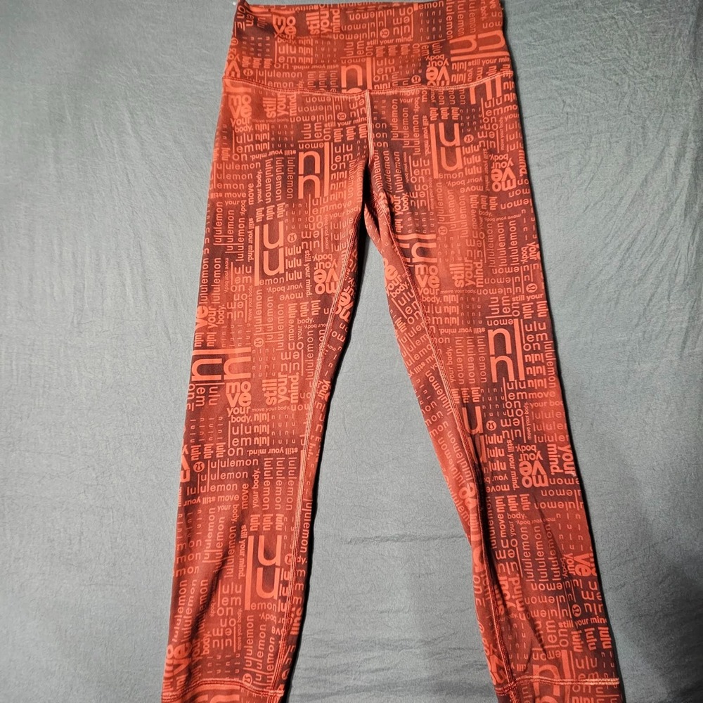 Lululemon Womens High Rise Leggings Rust Orange Logo Script Print Size 8